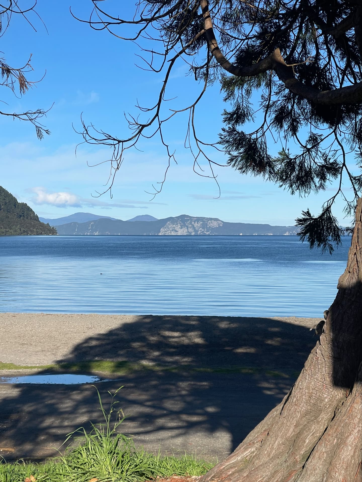 Lake Taupō from the Kinloch shoreline with the western bluffs and ranges across the water